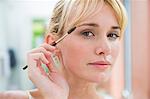 Woman using eyebrow brush