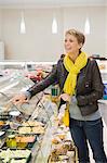 Woman choosing food in a supermarket