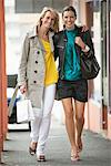 Two women walking in a corridor