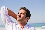 Man looking up on the beach