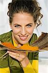 Portrait of a woman holding spices