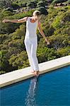 Woman standing at the poolside