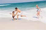 Family playing on the beach