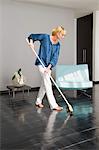 Woman cleaning floor with a mop