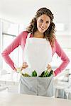 Woman standing with vegetables in the kitchen