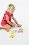 Girl solving a jigsaw puzzle