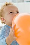 Baby boy playing with a balloon