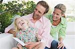 Girl smiling with her parents