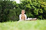 Boy sitting in a park