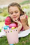 Girl looking at Easter eggs