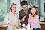 Family preparing breakfast in the kitchen