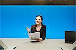 Businesswoman doing paperwork in a conference room