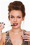 Young woman eating caviar