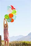 Girl playing with balloons