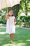 Cute little girl holding an umbrella