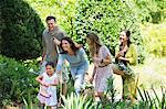 Happy multi generation family enjoying in the garden