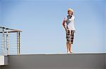 Teenage boy standing at the edge of a terrace