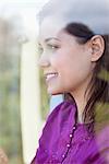 Young woman looking out of the window