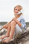 View of girl holding pinwheel and contemplating