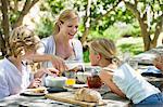 Family having food at front or back yard