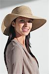 Portrait of a woman wearing sun hat and smiling