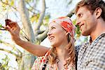 Young couple taking a picture of themselves with a mobile phone