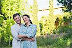 Portrait of a happy mature couple romancing in a garden