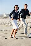 Couple running on the beach