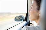 Young woman driving a car