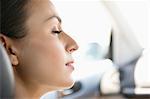 Young woman sleeping in a car