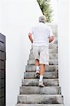 Senior man moving up steps