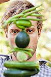 Young man holding vegetables