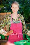 Portrait of a woman gardening and smiling