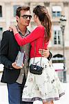 Romantic couple on a street, Paris, Ile-de-France, France