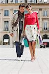 Couple walking on a street, Paris, Ile-de-France, France