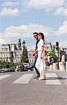 Couple crossing the road, Paris, Ile-de-France, France