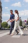 Couple crossing the road, Paris, Ile-de-France, France