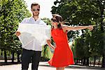 Man reading a map with a woman pointing, Terrasse De l'Orangerie, Jardin des Tuileries, Paris, Ile-de-France, France