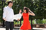 Woman shouting on a man reading a map, Terrasse De l'Orangerie, Jardin des Tuileries, Paris, Ile-de-France, France