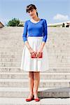 Woman standing on steps, Paris, Ile-de-France, France