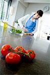 Young woman chopping parsley