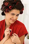 Close-up of a woman painting finger nails