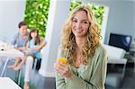 Woman holding a glass of juice