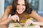 Woman chopping chives