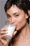 Portrait of a woman drinking milk from a glass