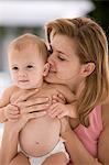 Woman kissing her daughter