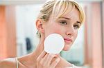 Woman applying face powder