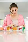 Woman having breakfast at a table