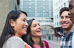 Close-up of friends standing together and smiling