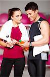 Sporty couple exercising at the fitness gym